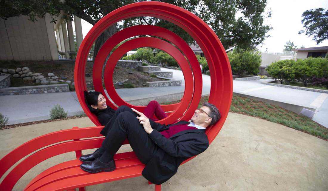 Pres. Chodosh and Priya sitting the Modified Social Benches