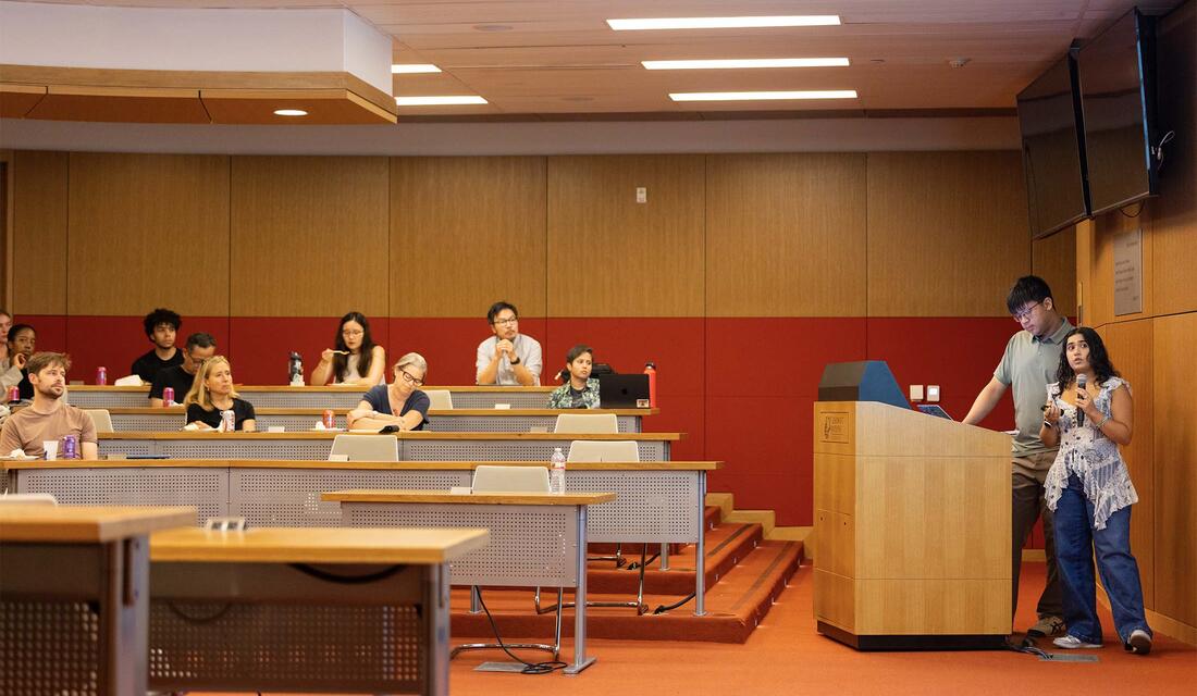Student at podium presenting work from Summer Research Program