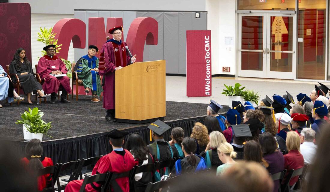 President Dudley at the podium in Roberts Pavilion during Convocation