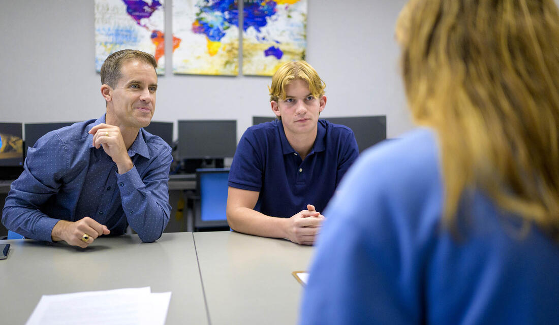 Prof. Cameron Shelton and student.