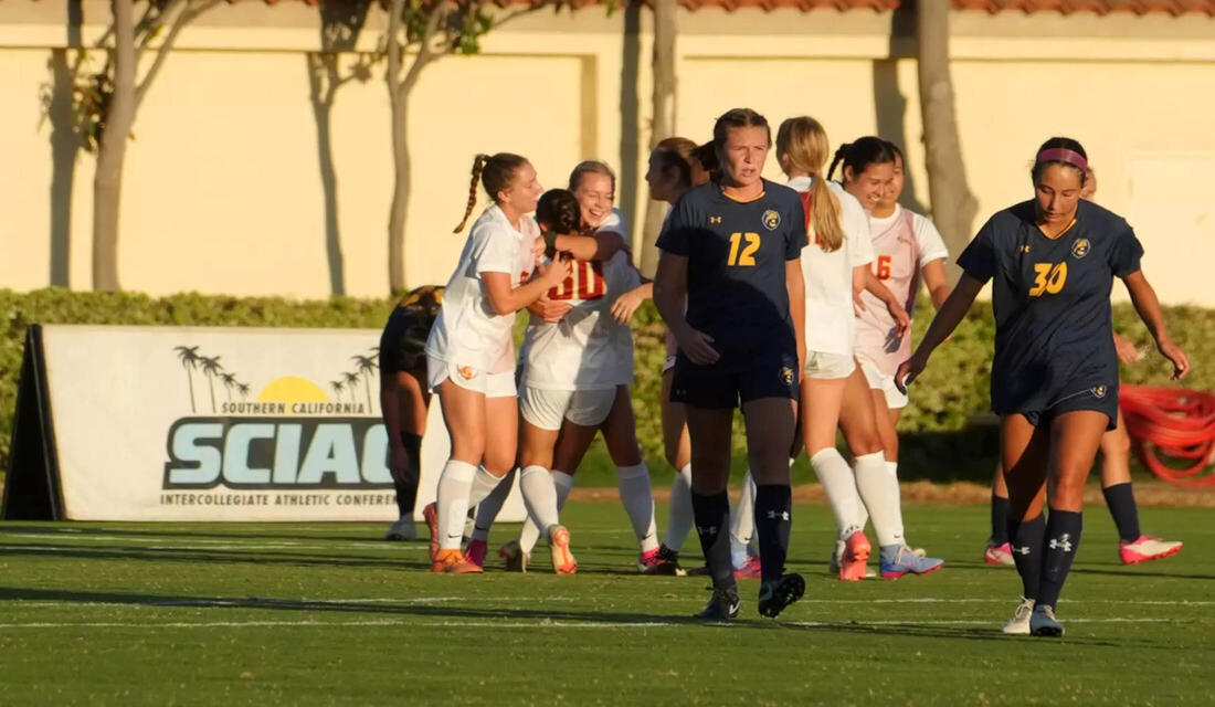 CMS Women's soccer celebrating on the field
