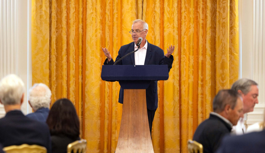 David Brooks speaking at podium