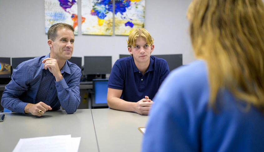 Prof. Cameron Shelton and student.