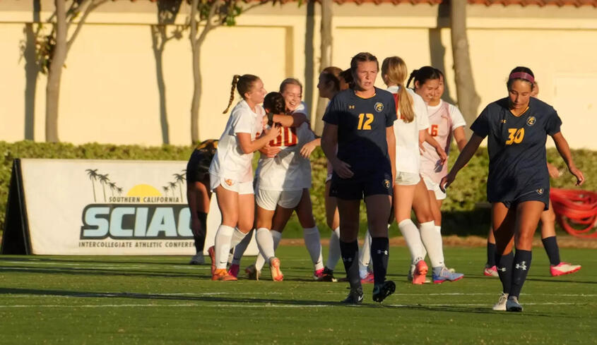 CMS Women's soccer celebrating on the field