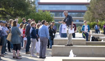 John Faranda '79 leads a tour group on a sunny day during Family Weekend 2022.