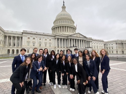 Labiba Hassan ’25 with a group of students in front of the Capitol Hill.