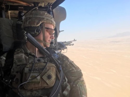 Dan Markert on helicopter over desert.