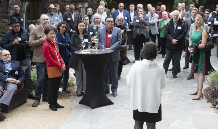 Faculty with friends and family at retirement party.