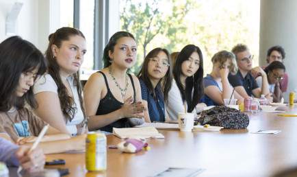 Group of students listening at table