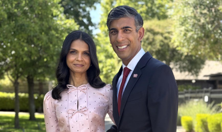 Rishi Sunak and Akshata Murty standing in garden