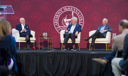 Ken Valach ’82, Henry Kravis ’67, and George Roberts ’66 P’93 on stage during their fireside chat at CMC Leads: The Summit.