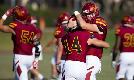 CMS football players celebrate