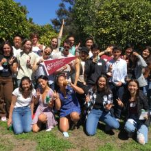 A group of students posing with CMC swag.