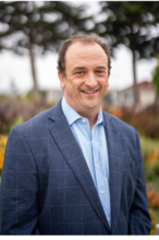 Man in gray suit and blue shirt