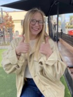 Photo of Jamee Mitchum giving two thumbs up.