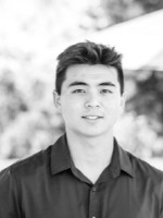 Black and white photo of Nick Wilson outside.