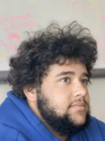 Photo of Eris Elliot in a classroom.
