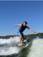 Photo of Thayer Breazeale surfing in the ocean.